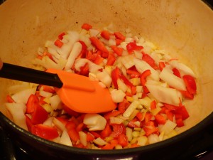 Cook onions and bell pepper until soft