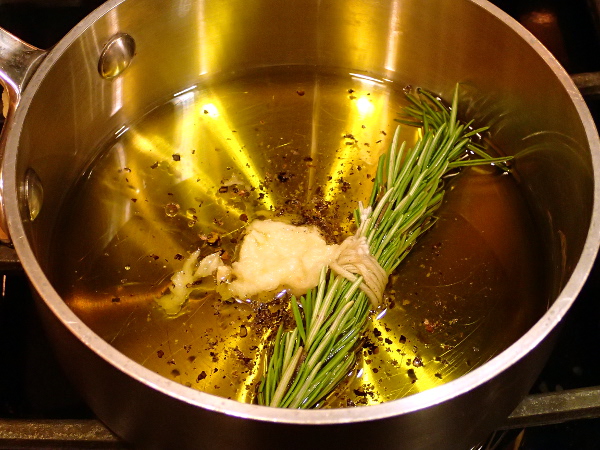 Olive oil, pepper, rosemary and garlic