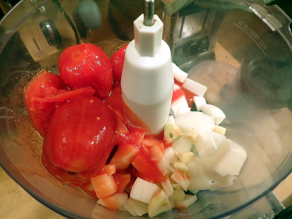Add tomato to food processor