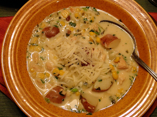 Top soup with mozzarella cheese
