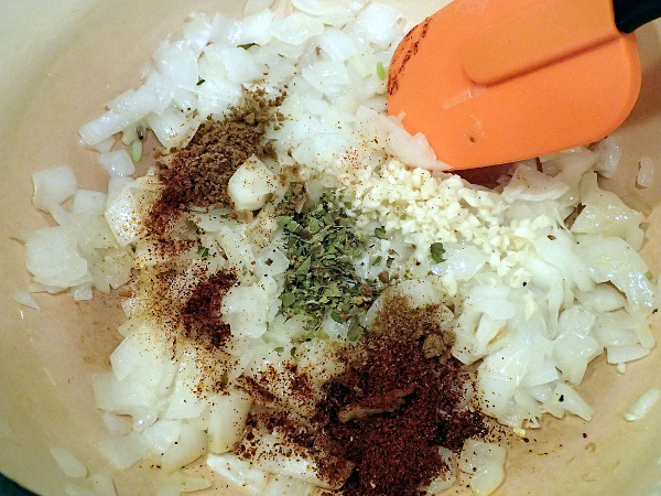 Add garlic, chili powder, cumin and oregano