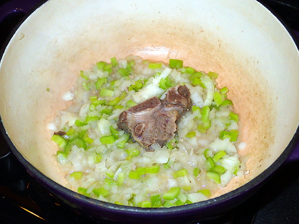 Cook onions, celery and soup bone